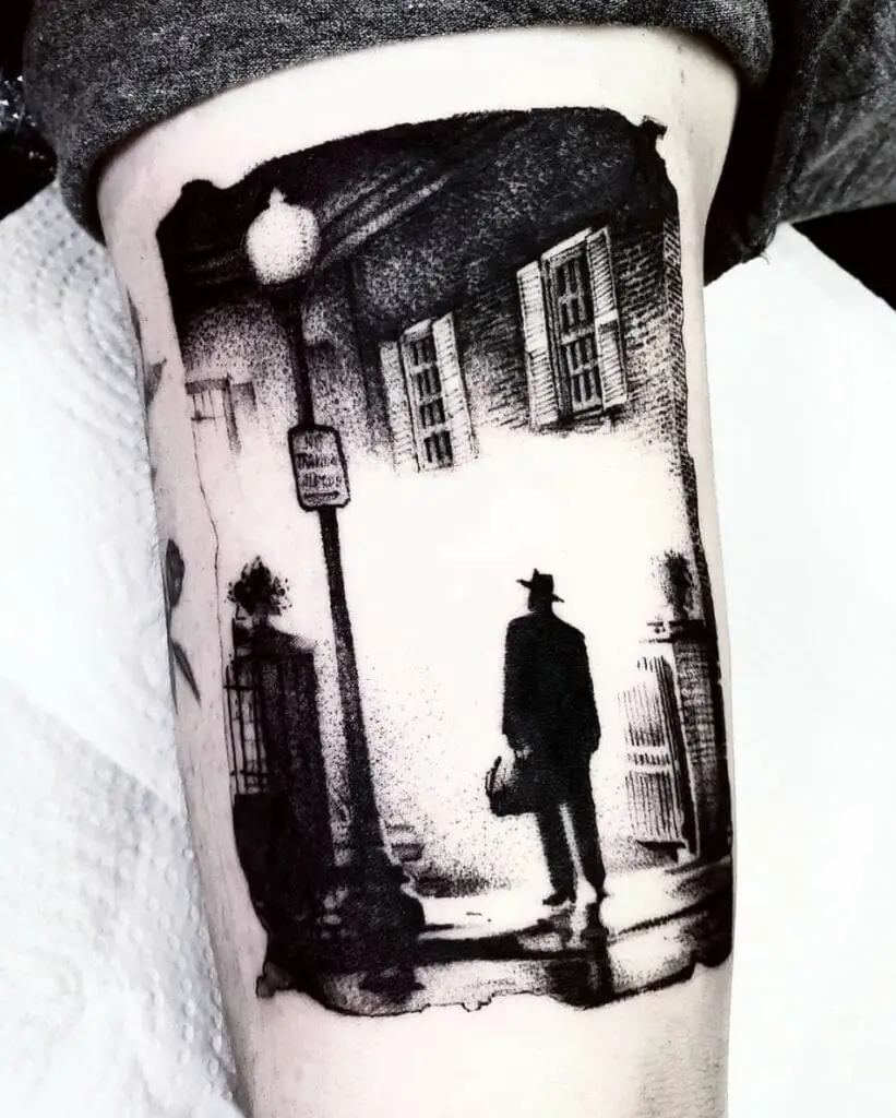 Man in Silhoutte Standing in Front of Mansion House Beside Light Pole Arm Tattoo