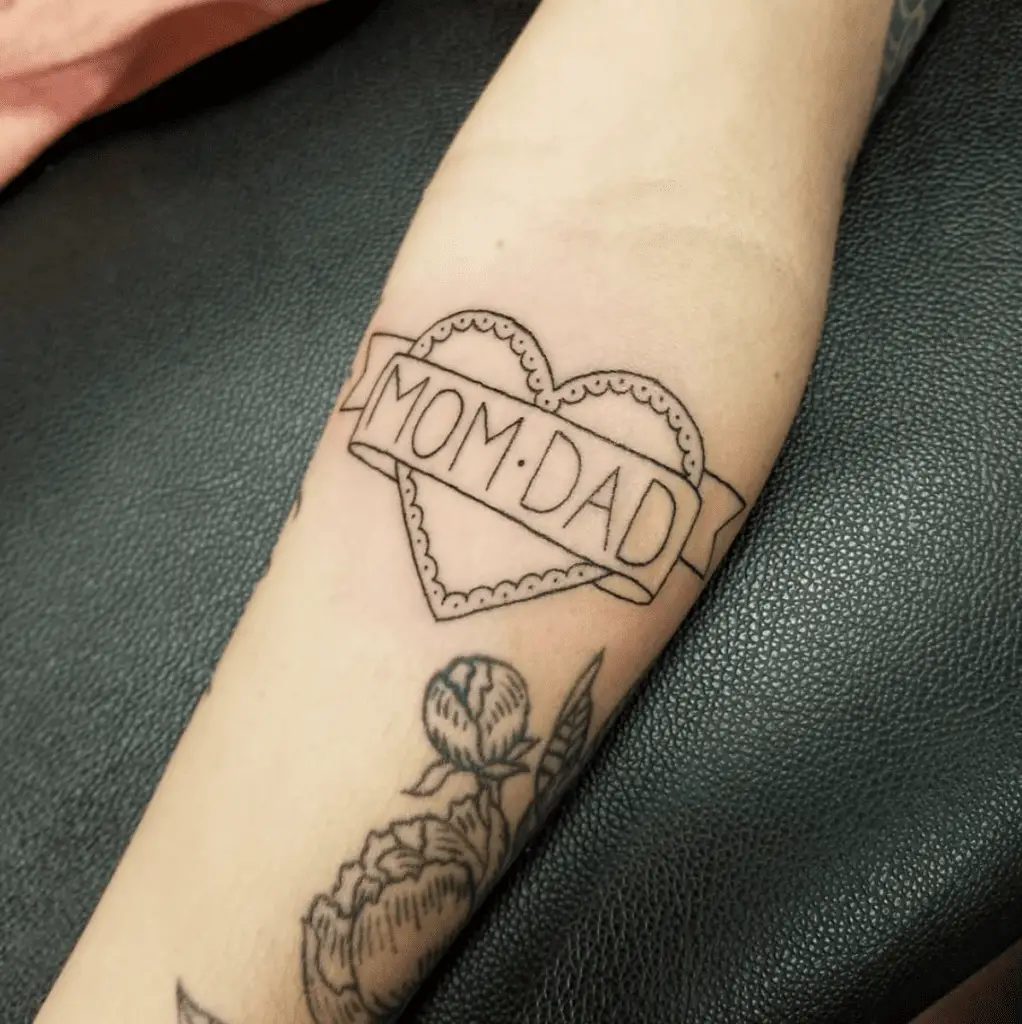 Mom and Dad Banner in Heart Outline Arm Tattoo