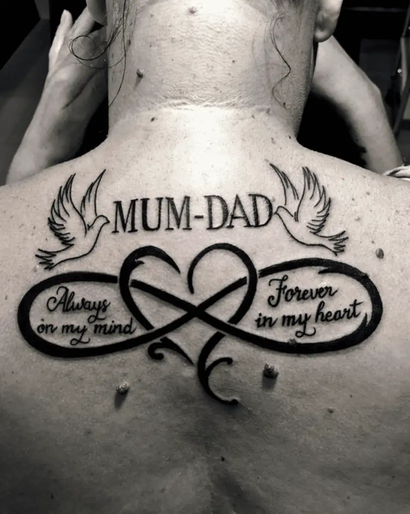 Mom and Dad With Infinity Sign Crossed Heart With Word Phrase and Two Dove Back Tattoo