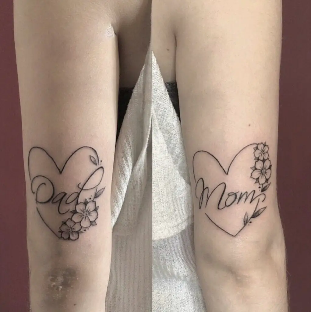 Mom and Dad in Floral Heart Outline Arm Tattoo