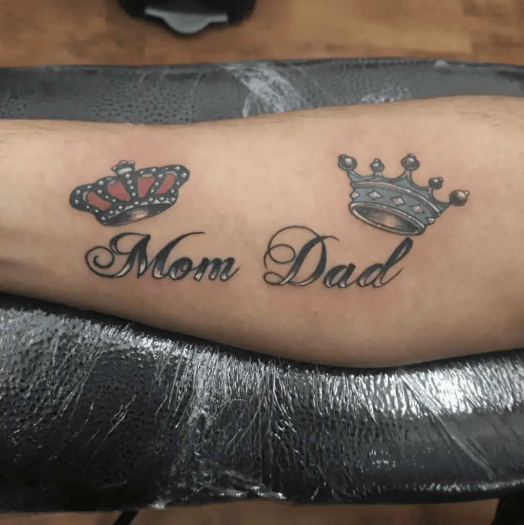 Mom and Dad in Gradient Text With Colored Crowns Arm Tattoo