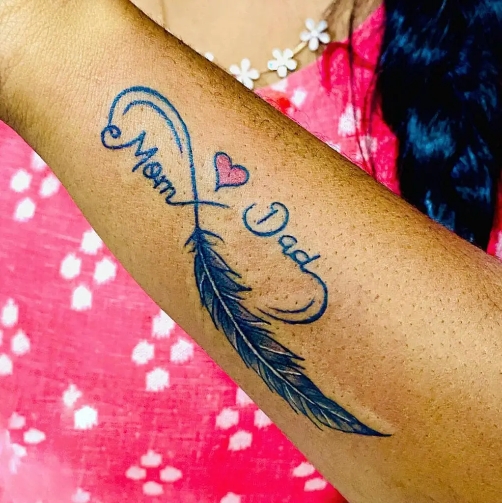 One Line Mom and Dad Infinity Feather With Red Heart Arm Tattoo