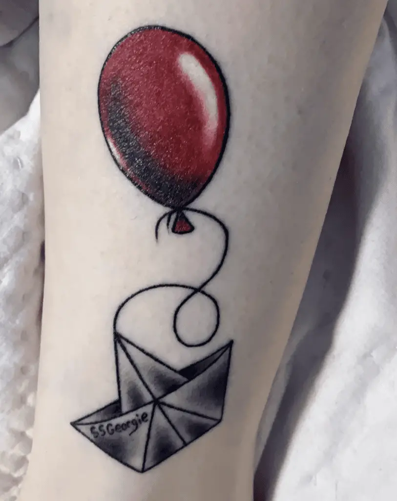 Paper Boat Tied Up With Huge Red Balloon Arm Tattoo
