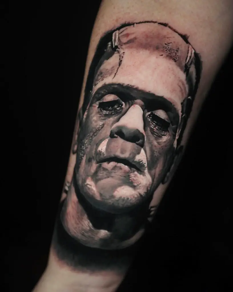 Portrait Male Having a Grim Expression Arm Tattoo