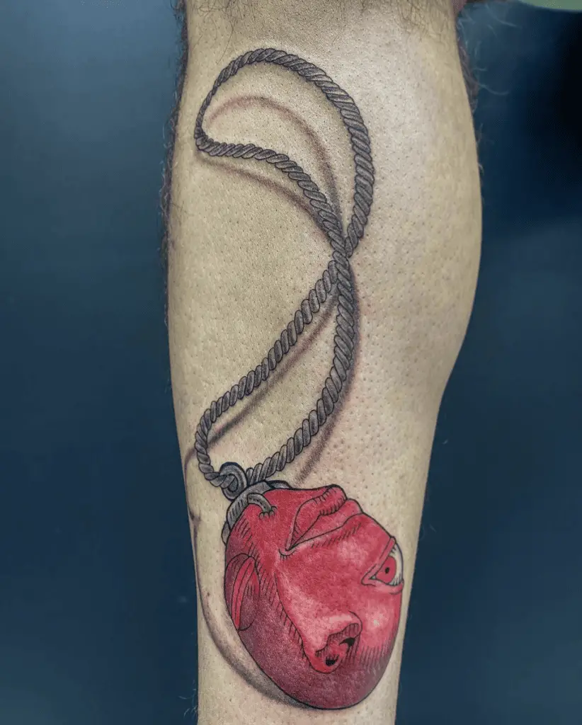 Realistic Behelit Necklace Leg Tattoo