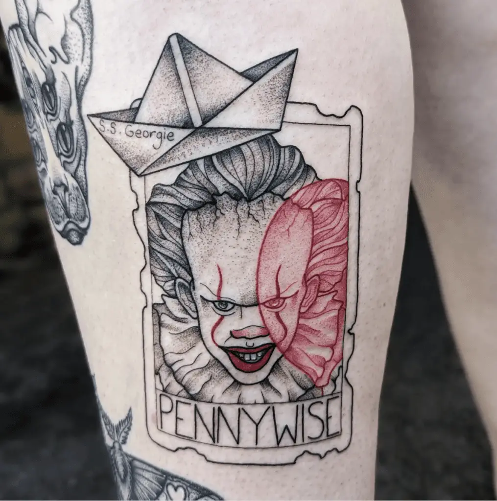 Scary Clown Holding A Red Balloon Tarot Card And A Paper Boat Above Leg Tattoo