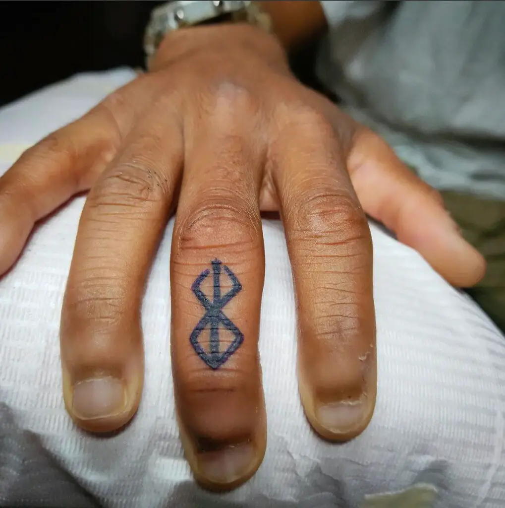 Small Simple Berserk Hunters Mark Hand Tattoo