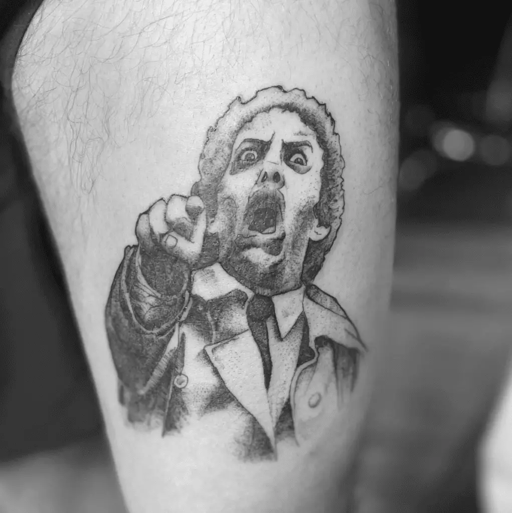 Surprised Man Pointing at the Front Leg Tattoo