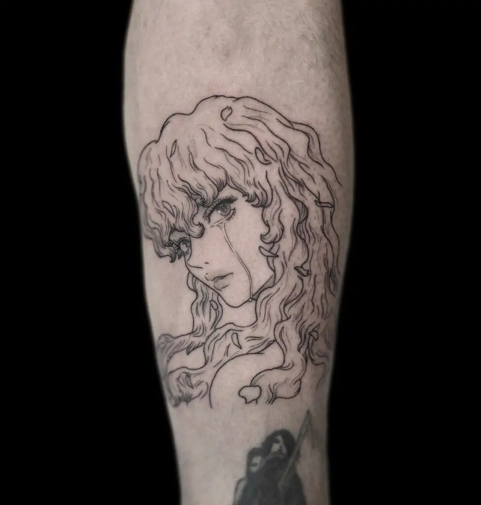 Tears on Griffith Face Looking at the Back Arm Tattoo