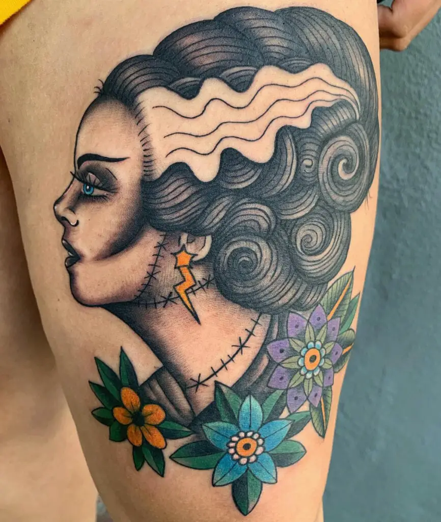 Traditional Style Side Portrait of a Woman With Florals Upper Tattoo