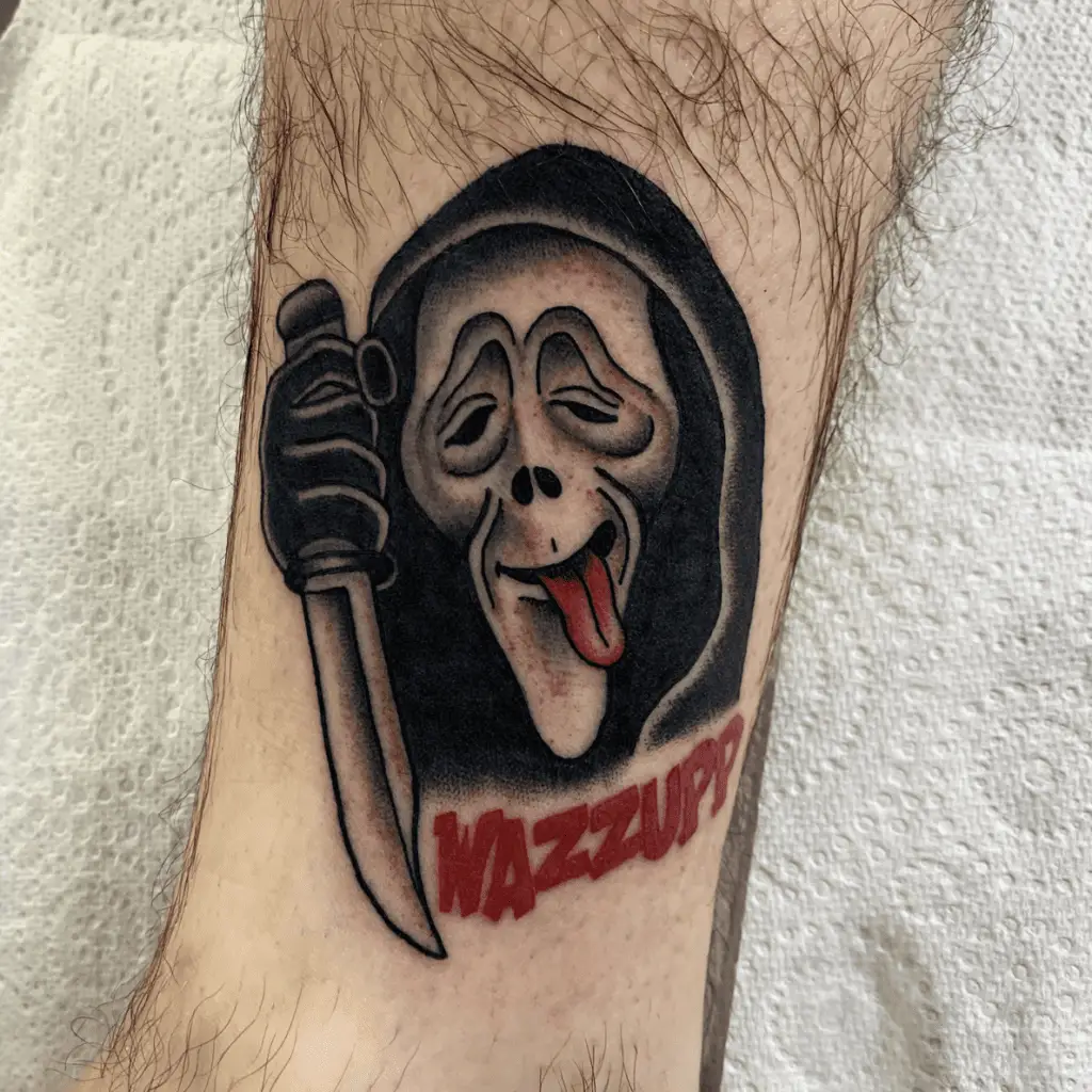 Wacky Tongue Out Grim Reaper Holding a Knife with Text Leg Tattoo