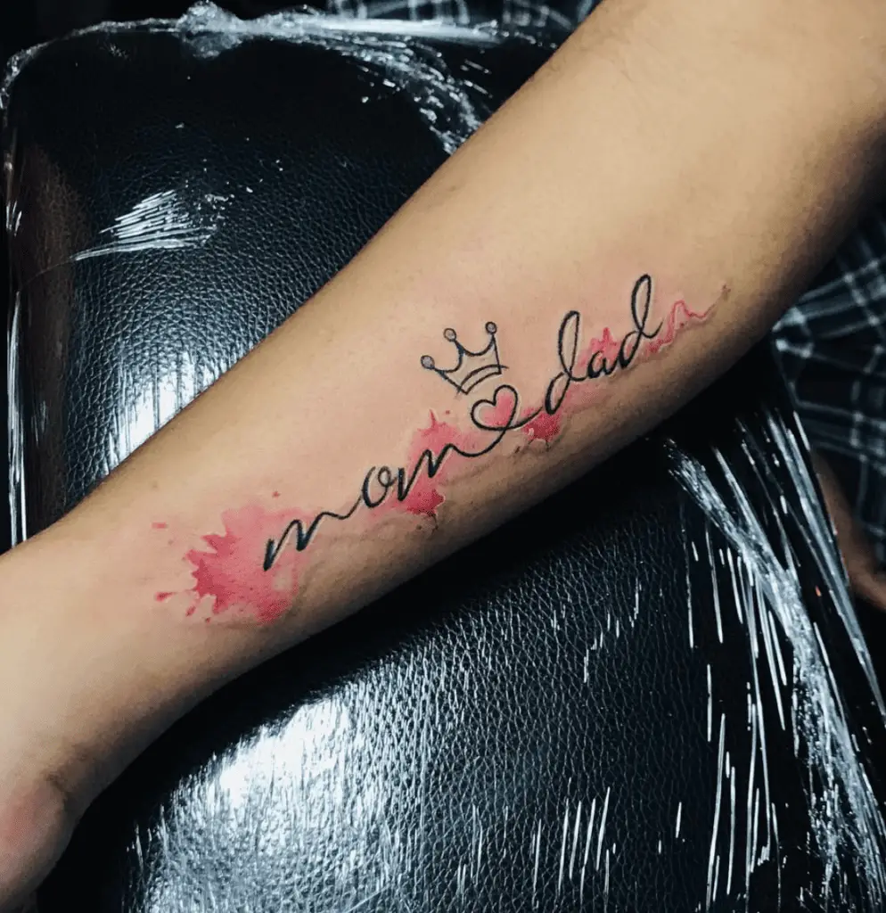 Watercolor Cursive Mom and Dad With Heart, Crown and Splatter Arm Tattoo