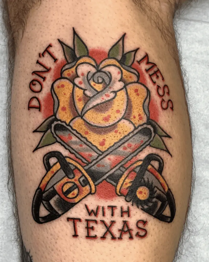 Yellow Rose with Two Chainsaw Crosses and Text Leg Tattoo