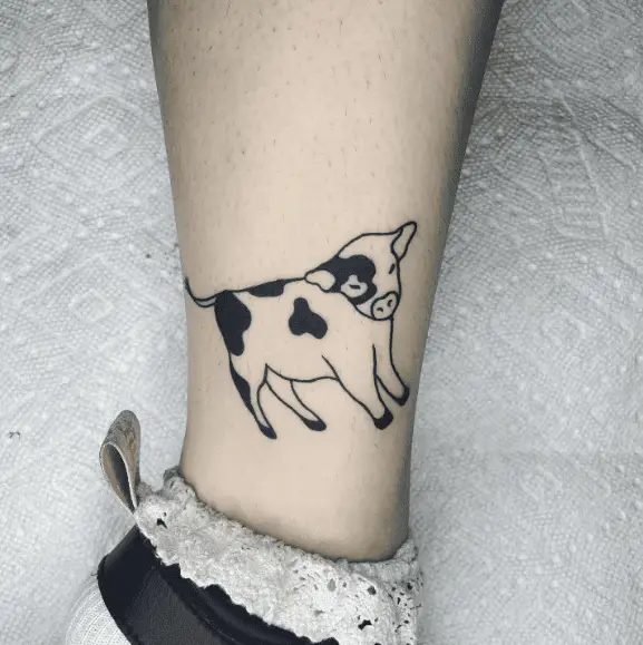 Black Spots Cow Leg Tattoo