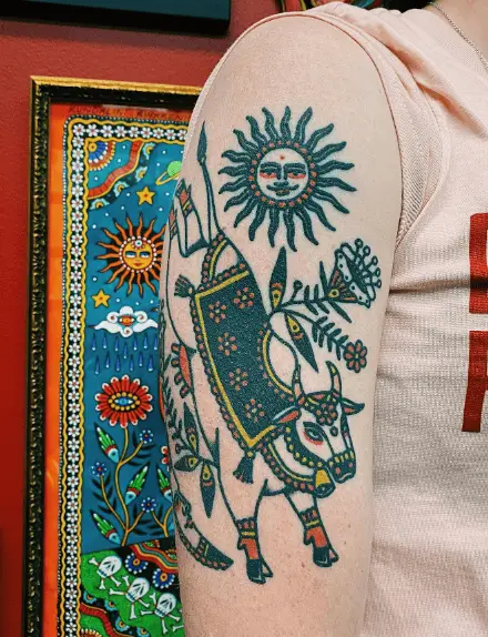 Sacred Cow with Sun Arm Tattoo