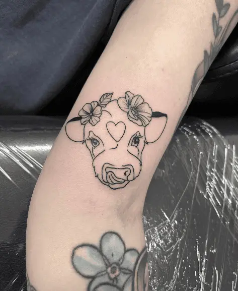 Tiny Little Cow Head Tattoo with Flowers