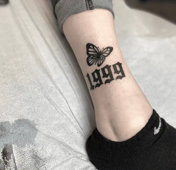 Butterfly with 1999 Leg Tattoo