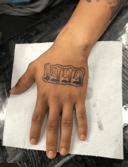 1999 Year Hand Tattoo