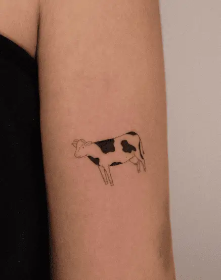 Black Spots Cow Arm Tattoo