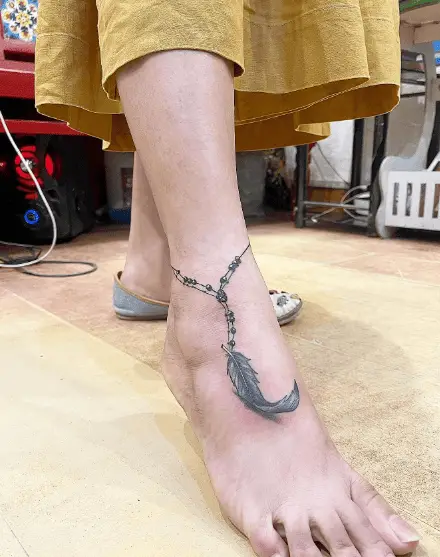 Greyscale Single Feather Anklet Tattoo