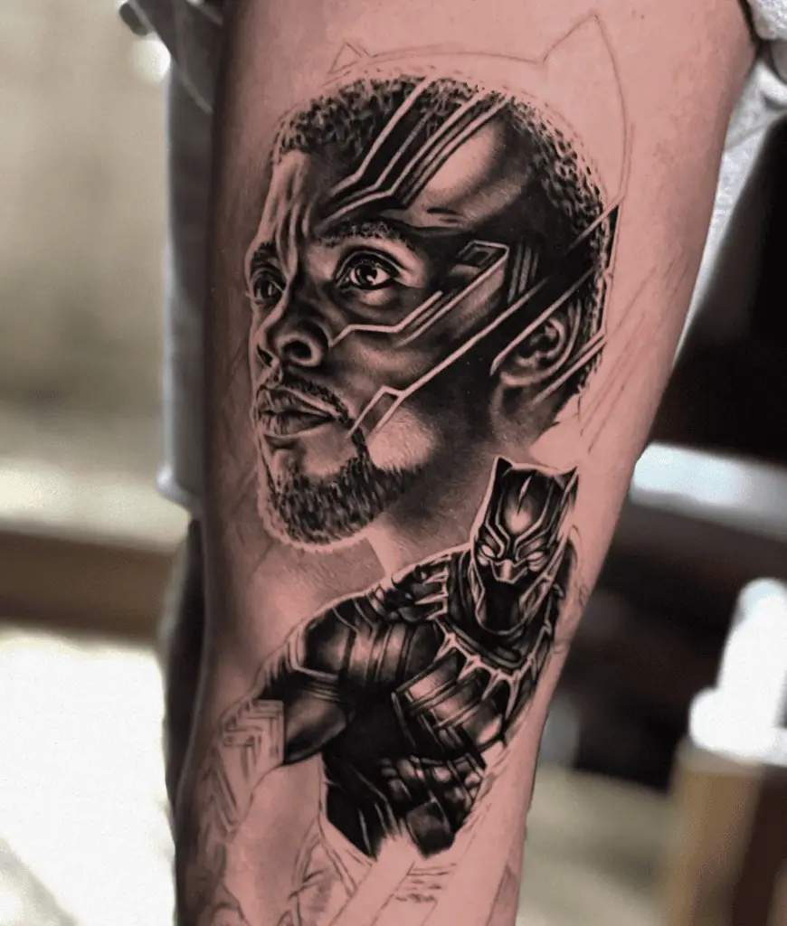 A Black Man Above Behind and His Black Panther Suit Below Leg Tattoo
