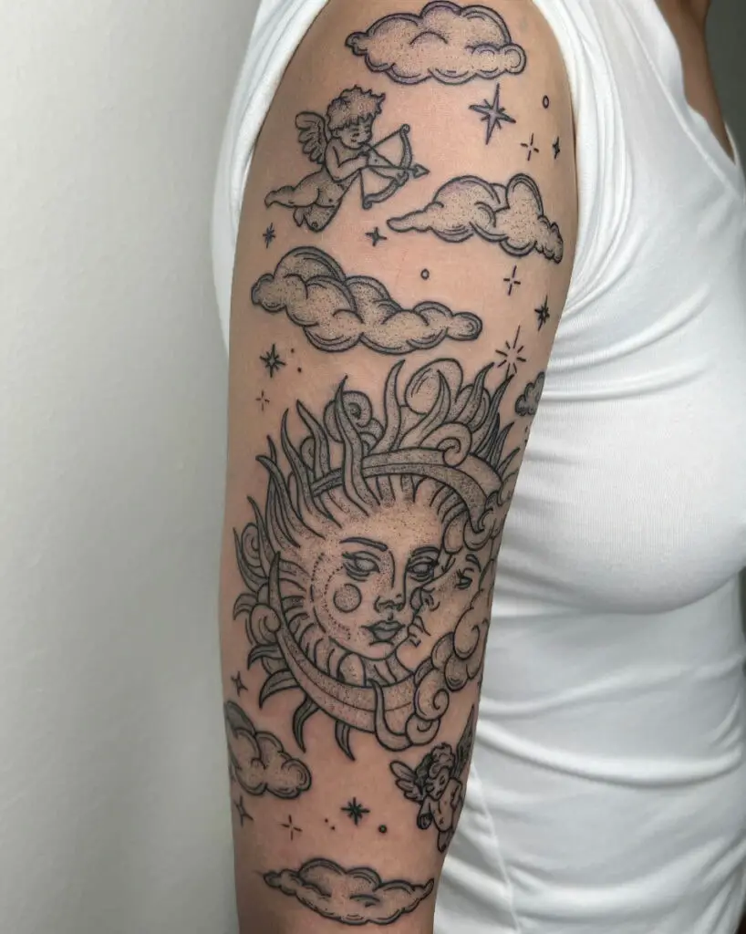 Artistic Sun and Moon Surrounded By Clouds, Stars and Cupids Arm Tattoo