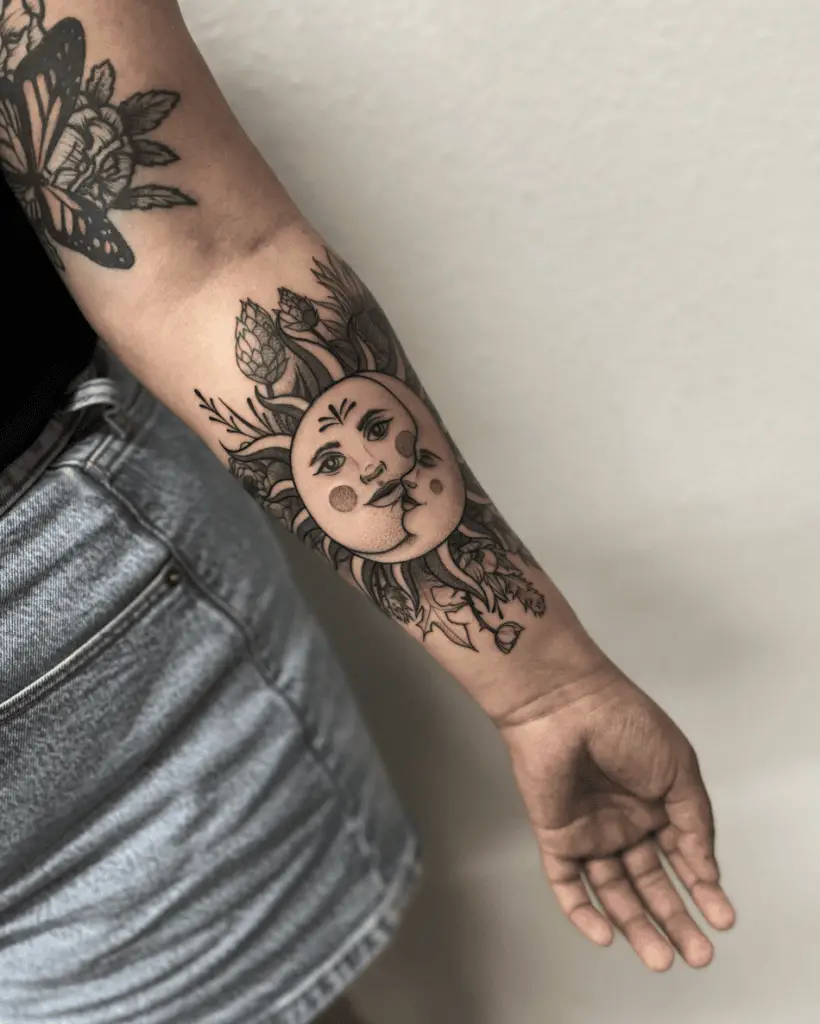 Black Detailed Floral Sun and Moon Arm Tattoo