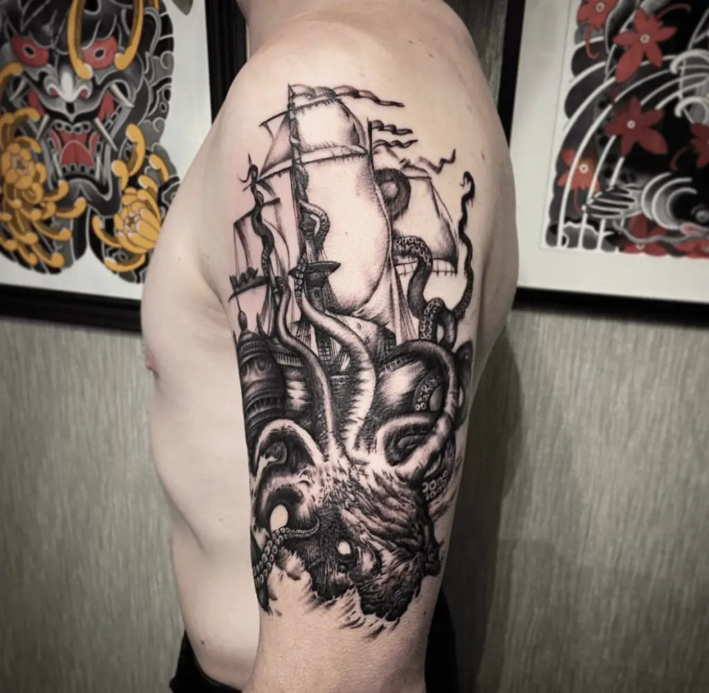 Black Detailed Kraken Crawling beside the Ship Upper Arm Tattoo