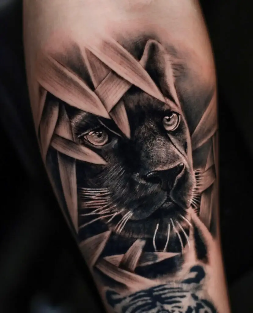 Black Panther Covered in Leaves Arm Tattoo