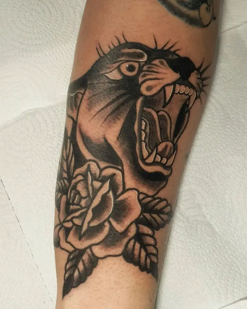 Black Panther Roaring With a Flower Arm Tattoo