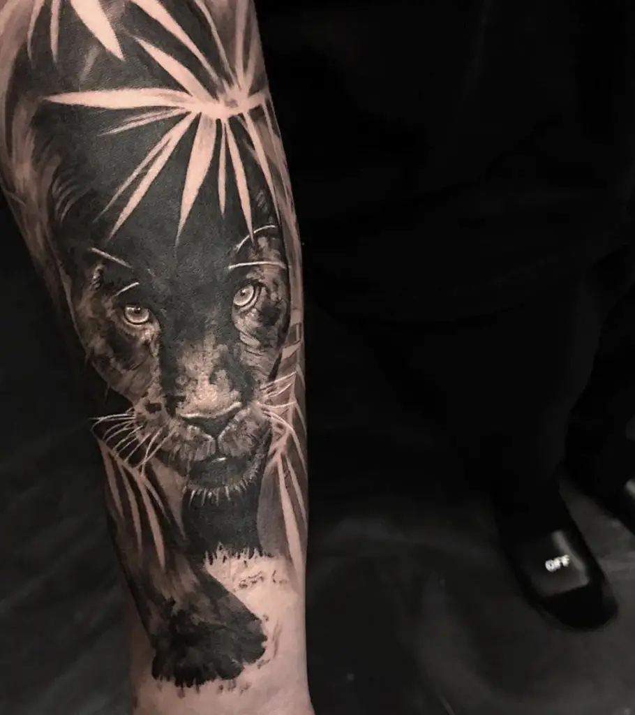 Black Panther Walking Over the Leaves Arm Tattoo