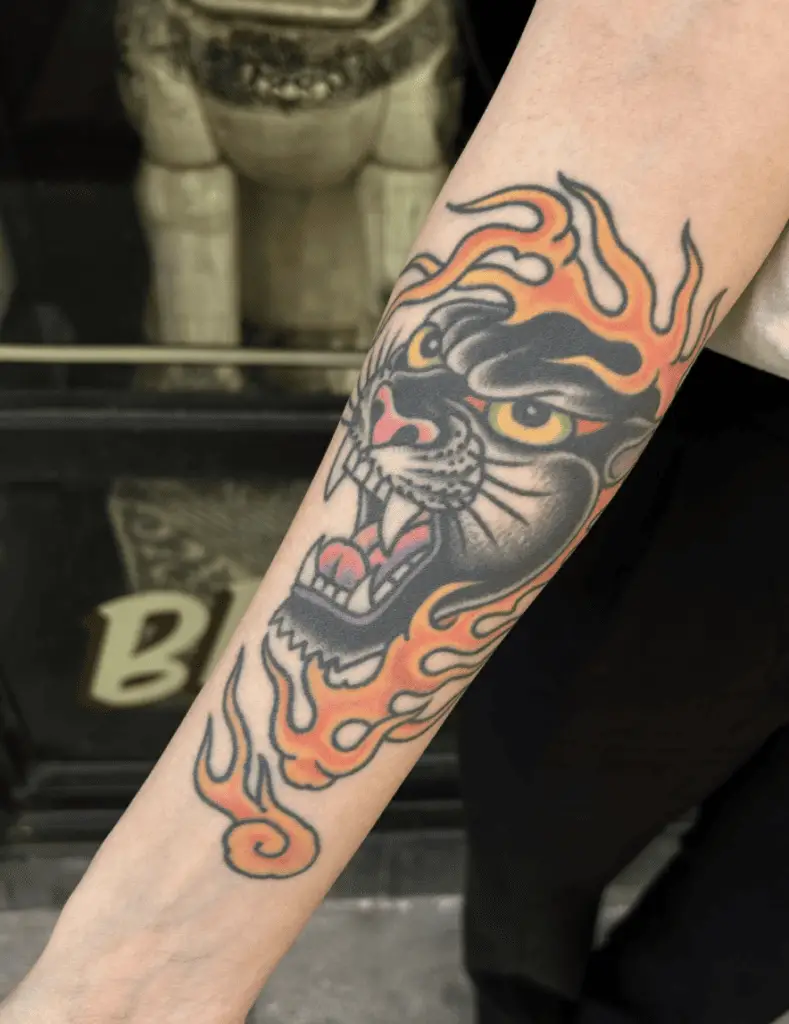 Black Panther Head With Fire Arm Tattoo