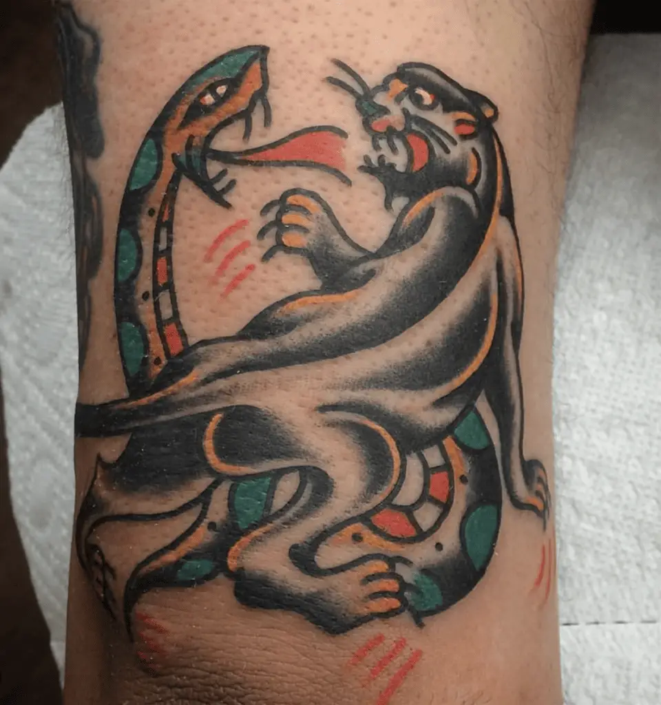 Black Panther and Snake Fighting Arm Tattoo