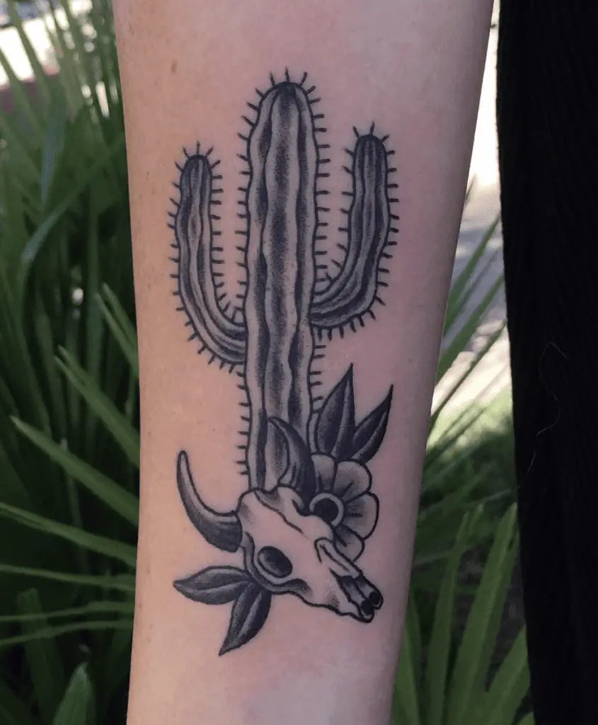 Black and Grey Cactus With Cow Skull and Flower Arm Tattoo