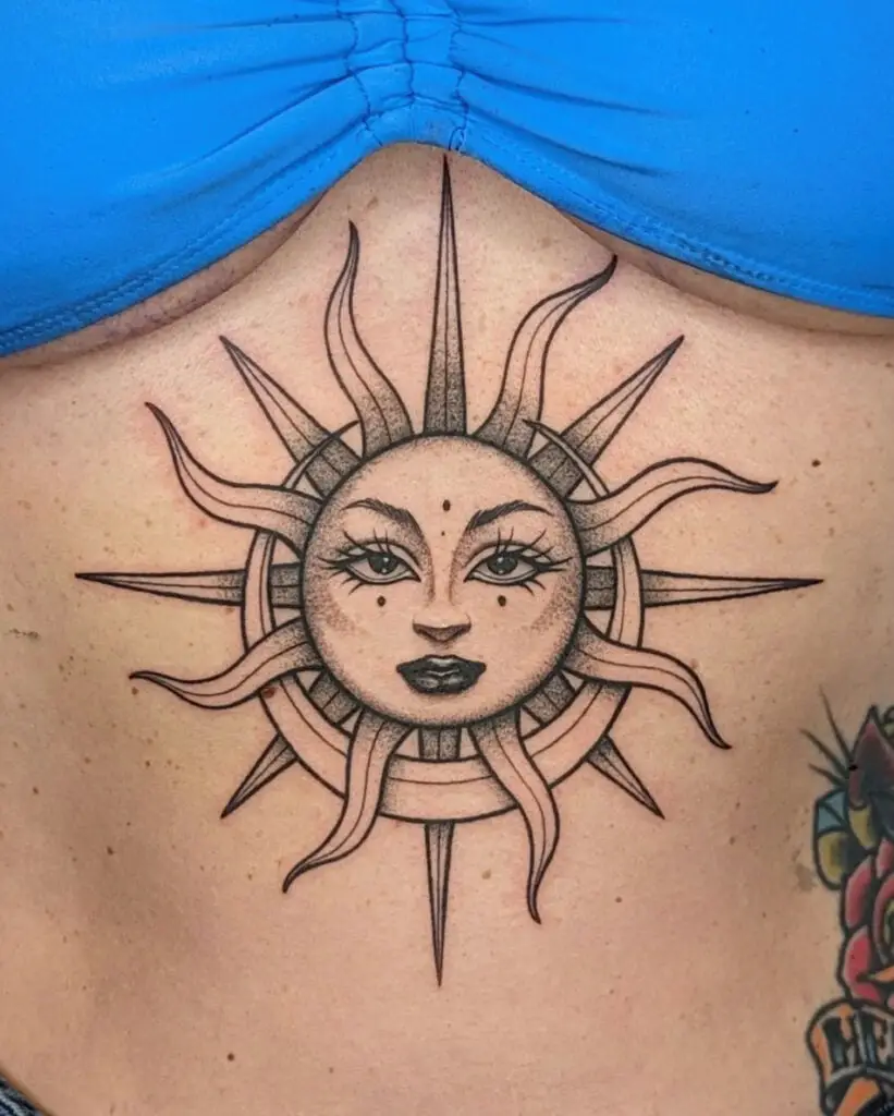 Black and Grey Crescent Moon Wrapped Around the Sun With Feminine Face Chest Tattoo