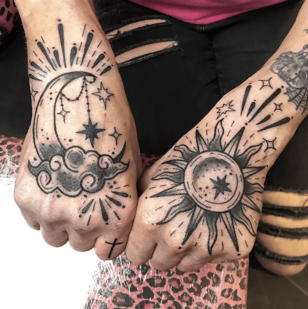Black and Grey Decorative Sun and Moon With Stars Hand Tattoo