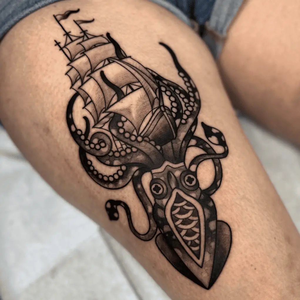 Black and Grey Giant Squid is Under the Ship Thigh Tattoo