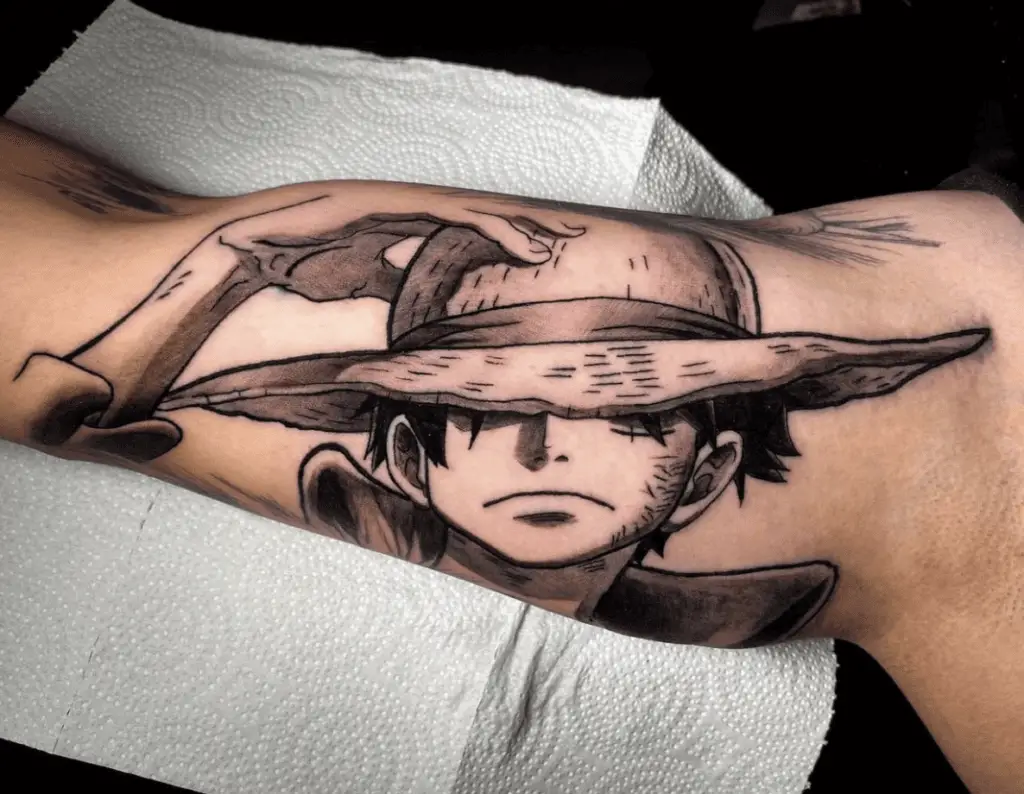 Black and Grey Luffy Holding His Hat Arm Tattoo