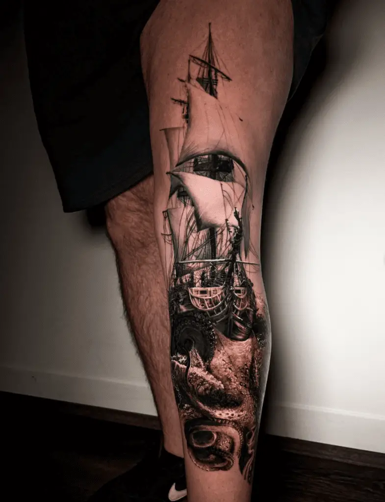 Black and Grey Realistic Kraken in Battle With a Sailing Ship Leg Tattoo