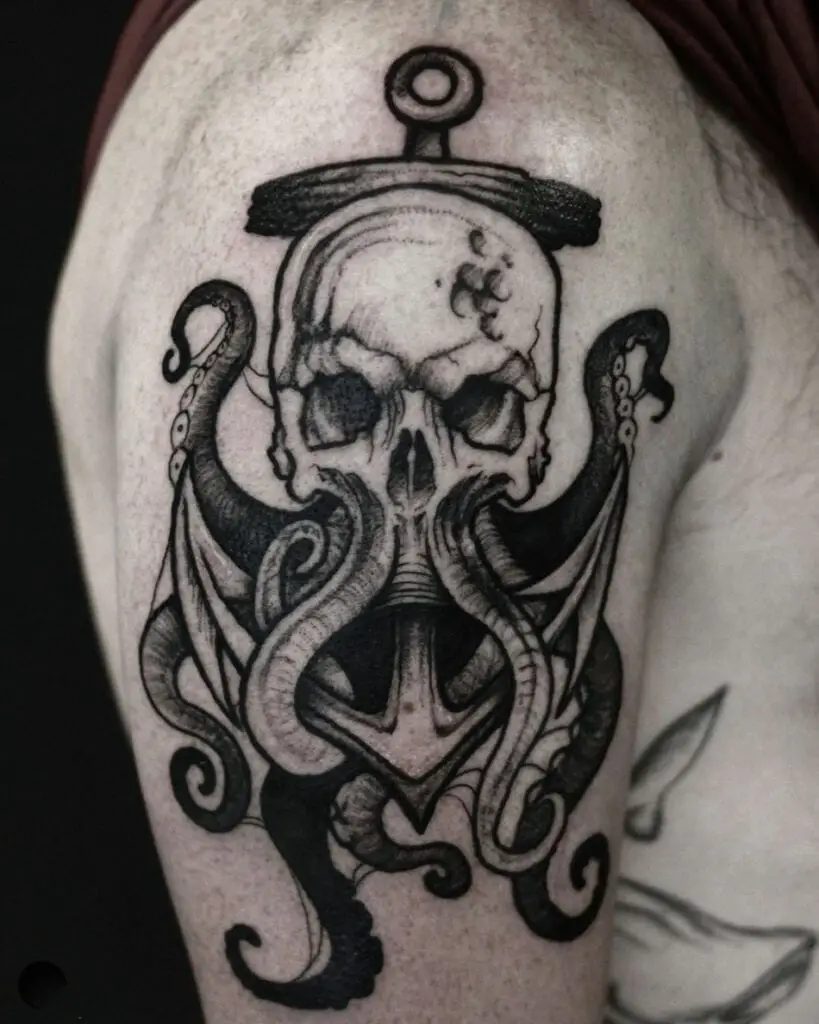 Black and Grey Kraken Skull Wrapped Around the Anchor Upper Arm Tattoo