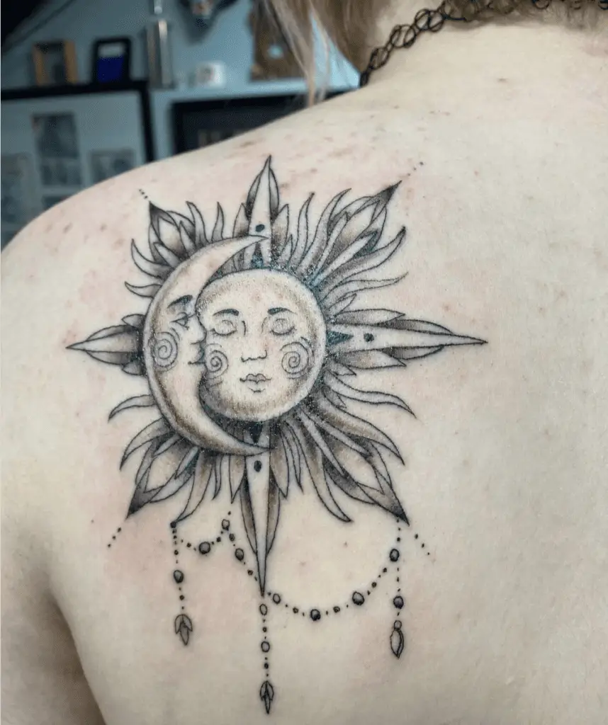 Black and Grey Sun and Moon Faces With Jewerly Design Back Tattoo
