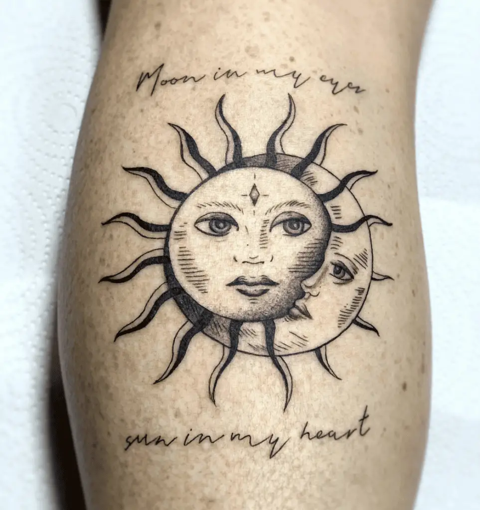 Black and Grey Sun and Moon Faces With Word Phrase Text Arm Tattoo