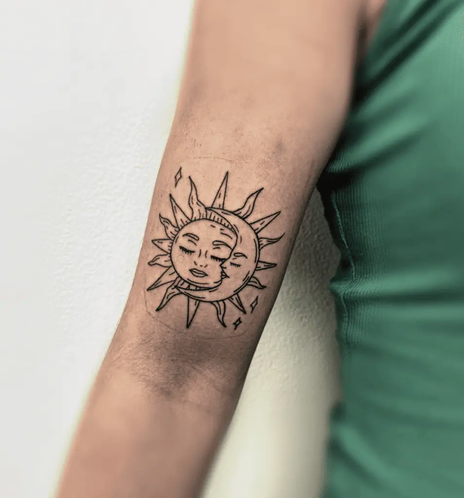 Bold Lines Sleeping Sun and Moon With Stars Arm Tattoo