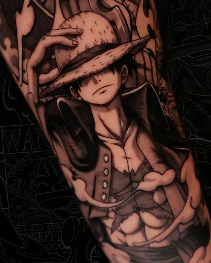Close Up Black and Grey Luffy Holding His Hat Arm Tattoo