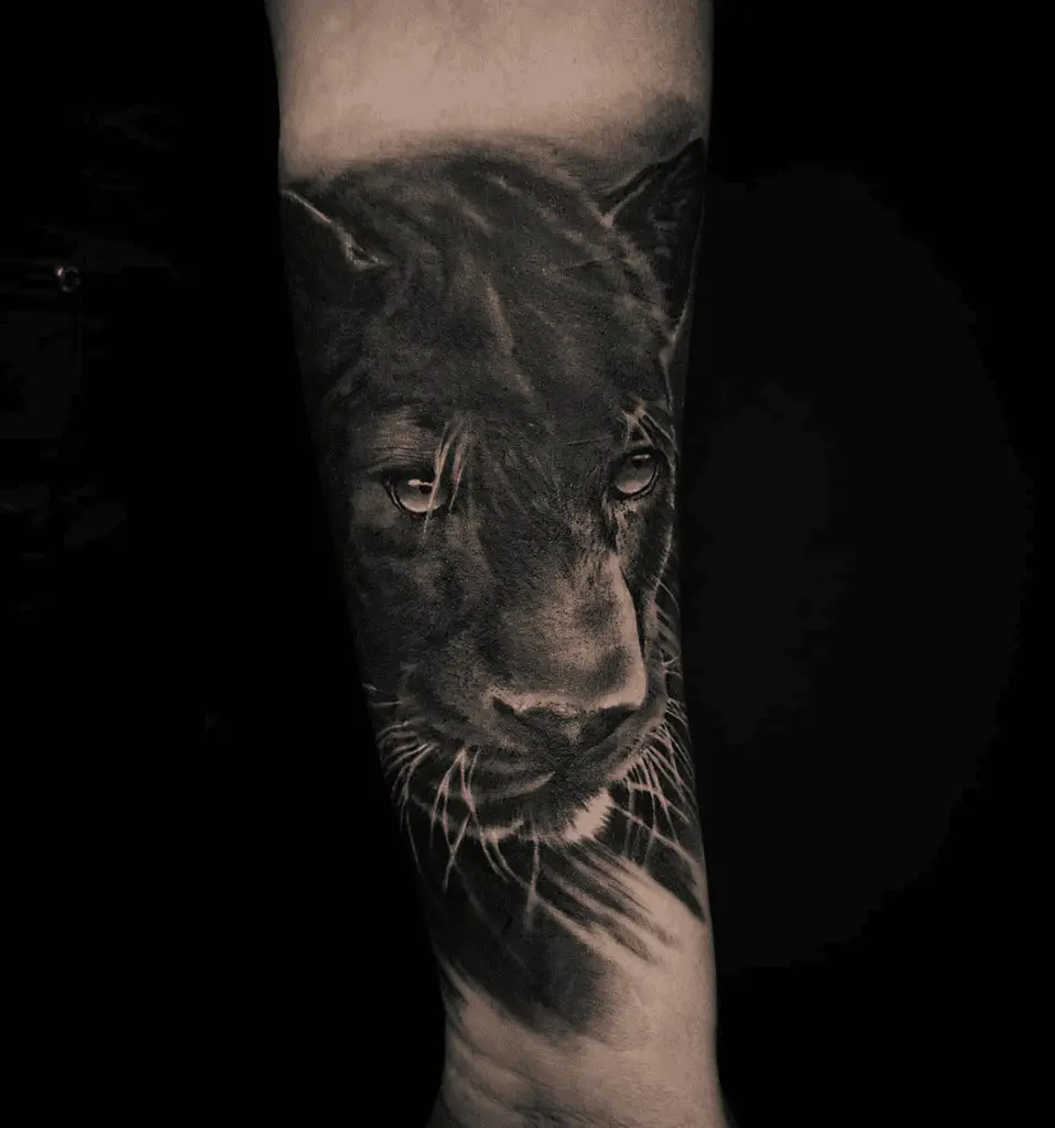 Close Up Portrait of Black Panther Arm Tattoo