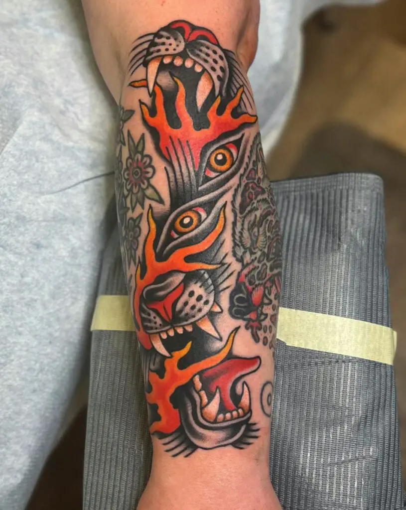 Colored Abstract Panther With Flames Arm Tattoo