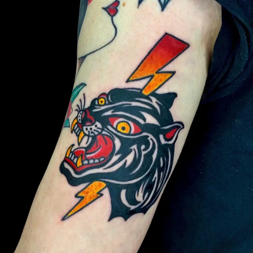 Colored Panther Stabbed By Lightning Bolt Symbol Arm Tattoo