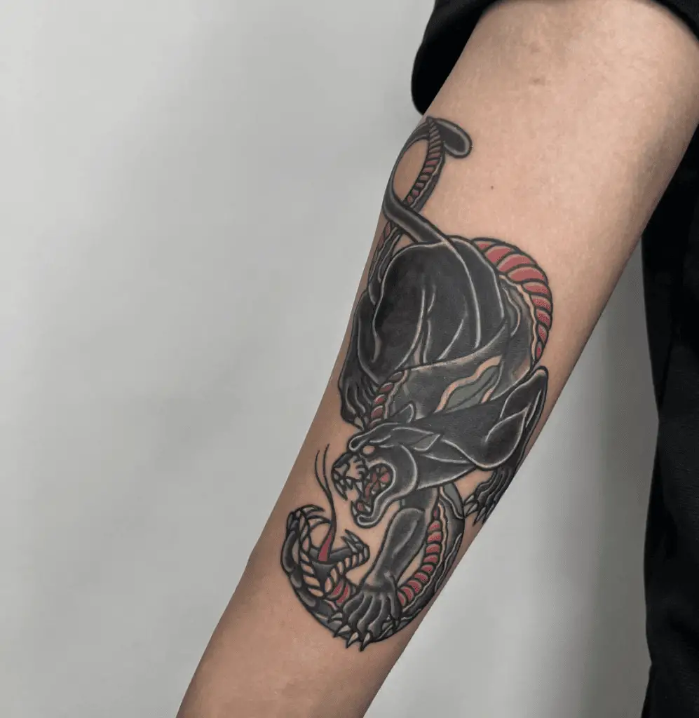 Colored Black Panther and Snake Fighting Arm Tattoo