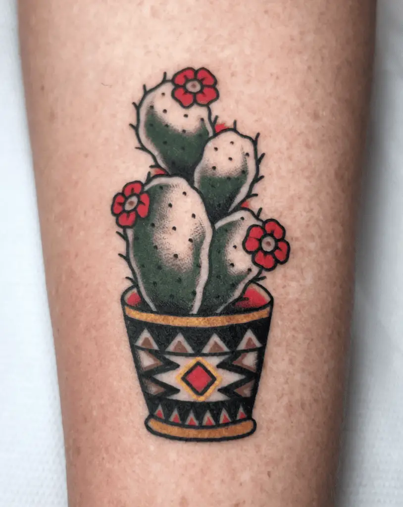 Colored Cactus With Red Flowers in Tribal Design Pot Arm Tattoo