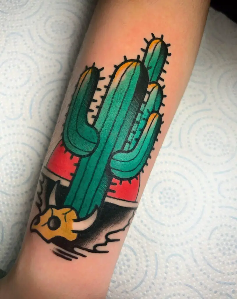 Colored Cactus and Cow Skull With a Red Sunset Background Arm Tattoo